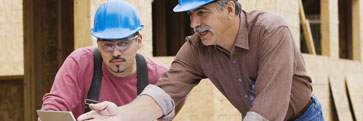 Two construction workers talking